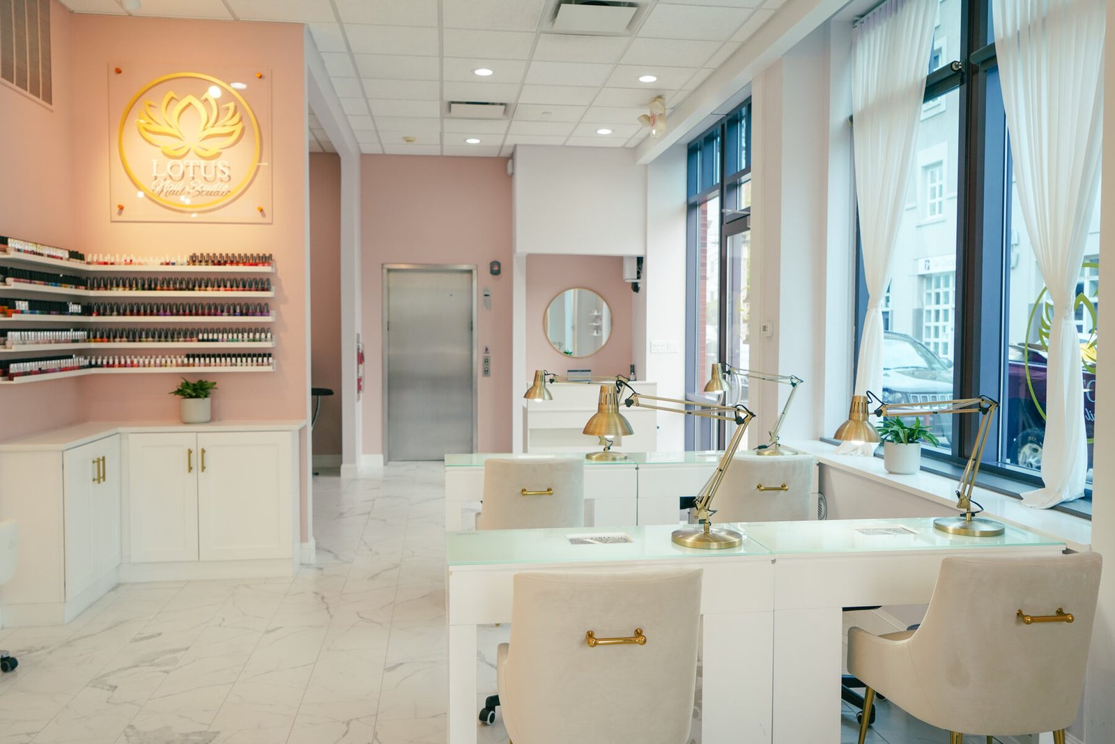 The manicure stations at Shadyside, beside the polish wall and the lit lotus sign