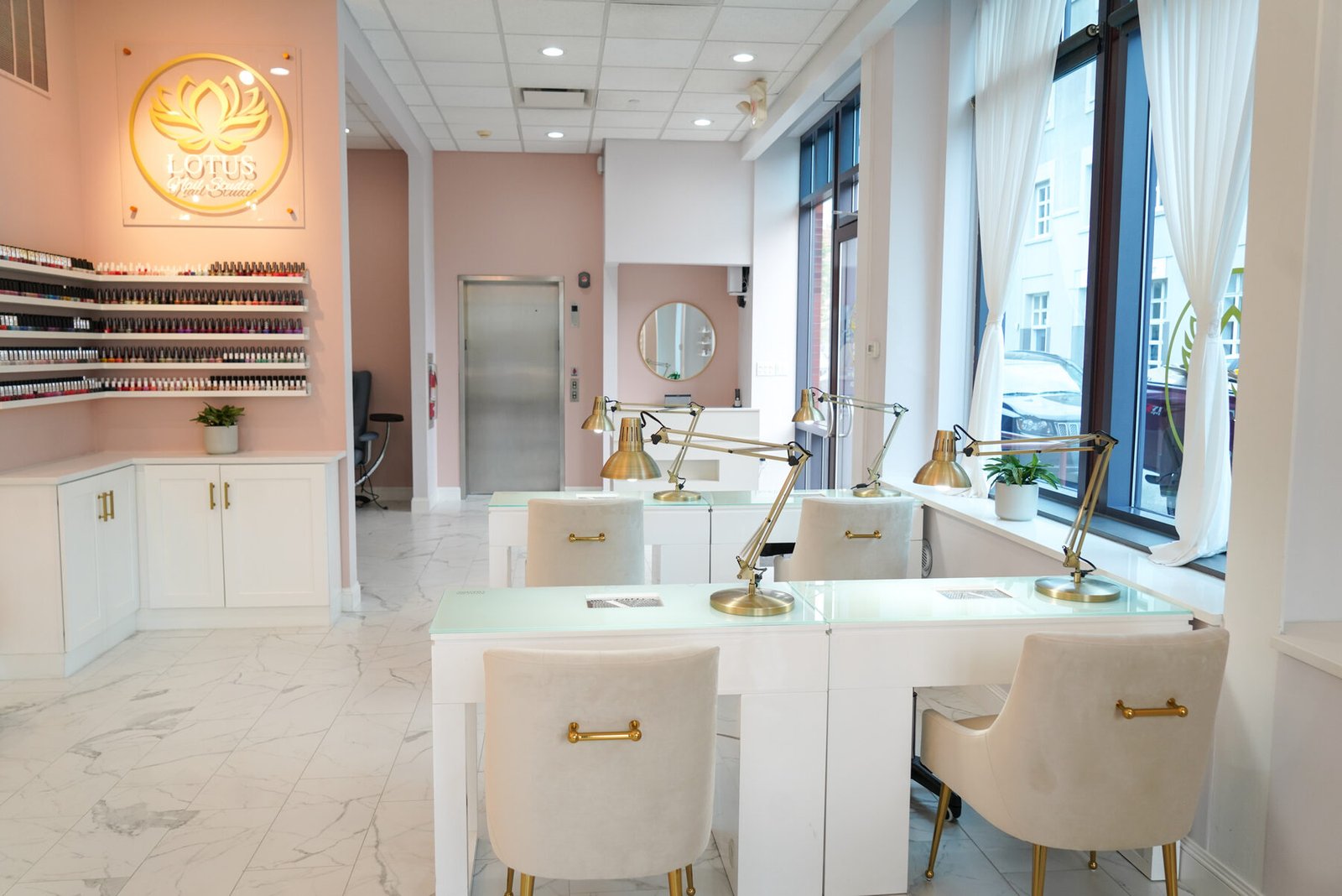 The polish wall and manicure stations at Lotus Nail Studio