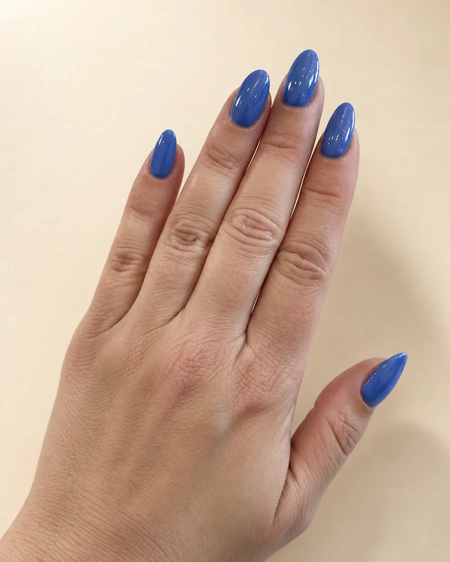 Cobalt blue polish on almond-shaped nails