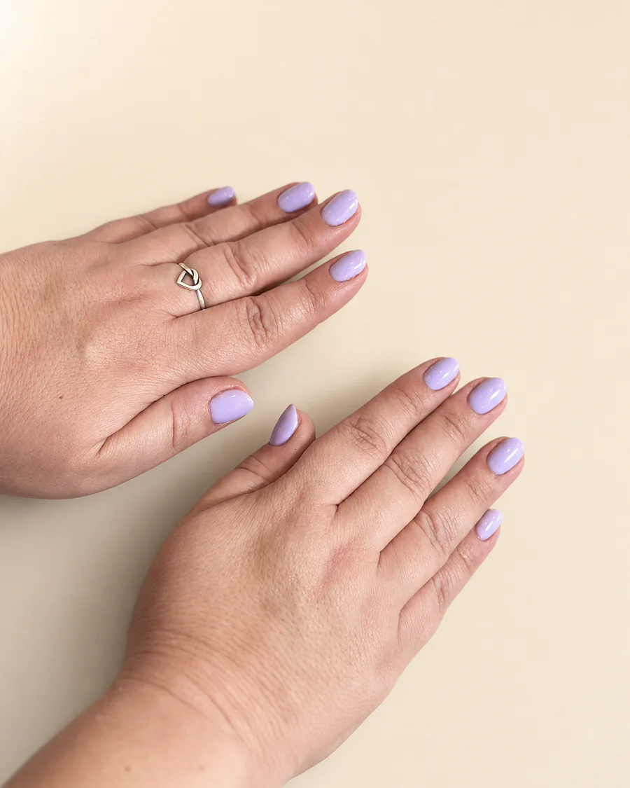Short round nails in a soft lilac shade