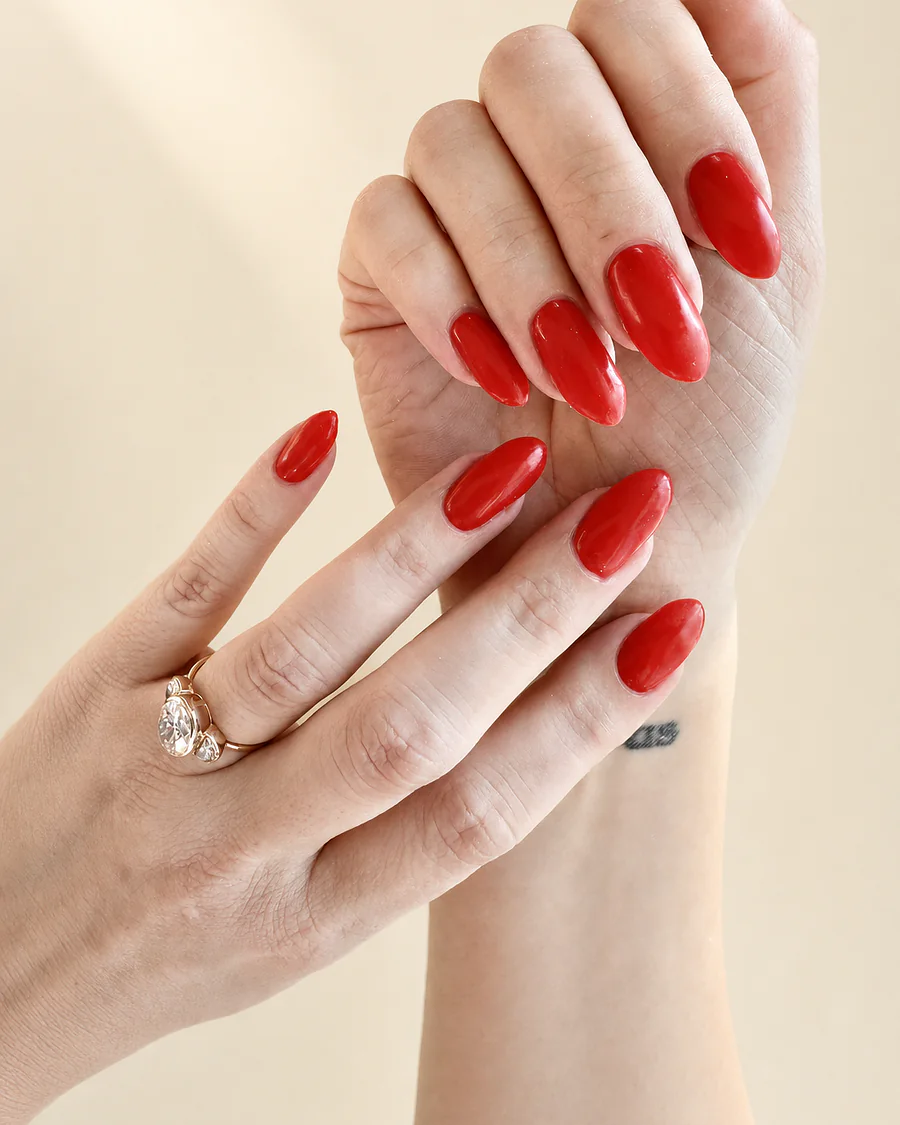 Long almond nails in a classic true red