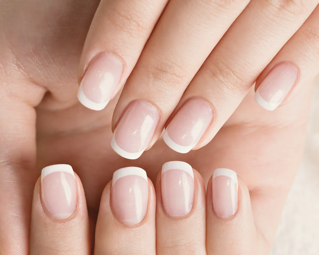 A long square overlay set finished with a French tip