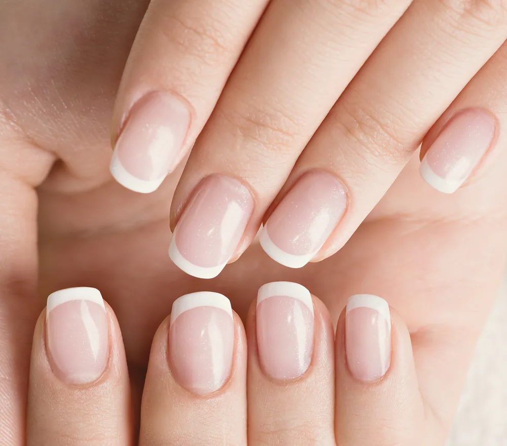 A finished French manicure in close-up