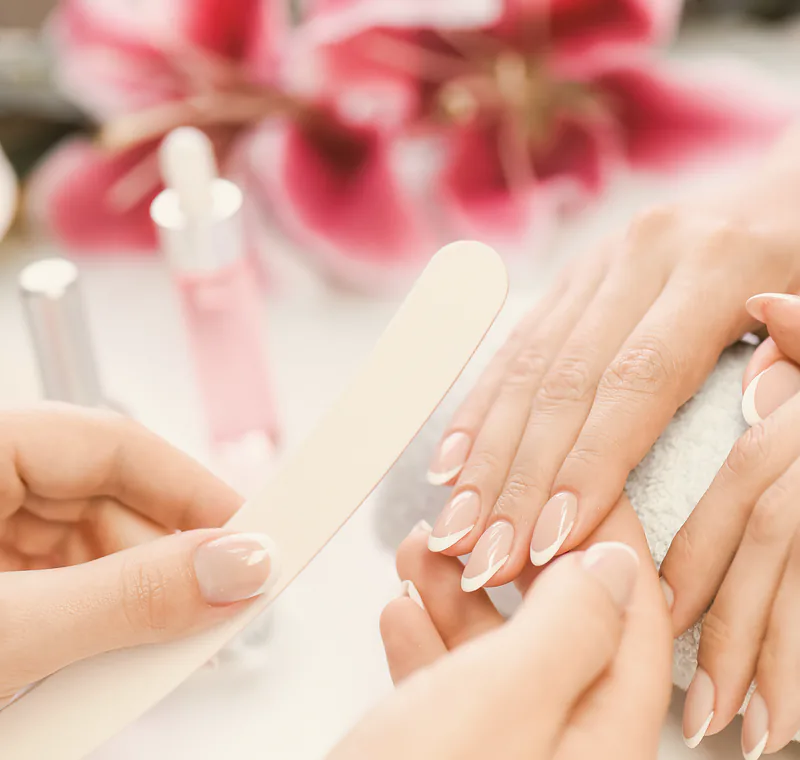 Builder gel extensions being filed to length